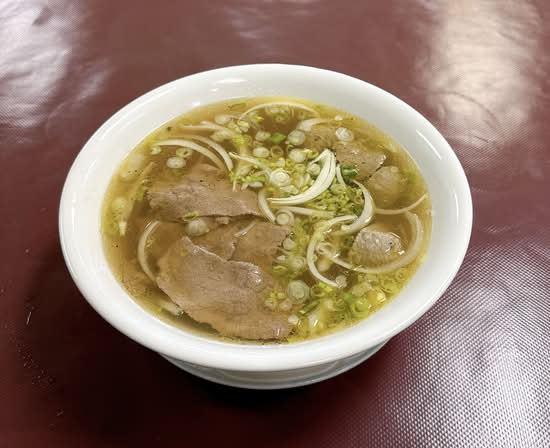 Vietnamese beef brisket pho with rice noodles and fresh herbs — Minh's Garden Saskatoon
