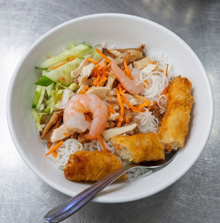 Vietnamese vermicelli noodle bowl with grilled chicken and spring rolls — Minh's Garden Saskatoon